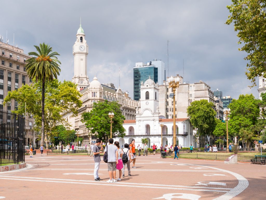 People on Plaza de Mayo and Cabildo building in Buenos Aires, Argentina